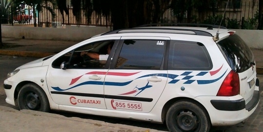 This is a photo of a newer, state run taxi. 90% of the people who use these taxis are tourists. The other 10% are state workers who are using them on to travel for government business. Compared to other modes of transportation, these taxis are expensive. They cost at least 1CUC per kilometer of travel. It would be hard to get a trip across town for less than 5CUC. While, technically, all state taxis are the same, the drivers in these newer cars tend to charge a bit more than those who have older cars. But, at least with the newer cars there is air conditioning and perhaps more safety features.