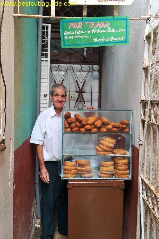 This is Miguel. He is an independent business owner in Vedado, Havana. He has set up shop, beside a school, and sells fried snacks to students. His prices are very low. Most of his products only cost 1 or 2 pesos (moneda nacional). Nevertheless, he is able to earn a salary which is well above average. Considering that he sells about 150 items per day, we can estimate that his daily revenue is about 10 CUC. That translates to a yearly revenue of over 2500 CUC. At a 50% profit margin, he is able to take home over 1000 CUC, after taxes. Miguel is a shining example of the opportunity for small business in Cuba. He works hard, but he is happy. He is almost 90 years old, but he still loves to get up every morning and work for himself and provide for his family. He is proud.