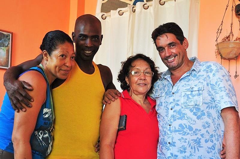 Gustavo (on the right) with Cuban friends and family.